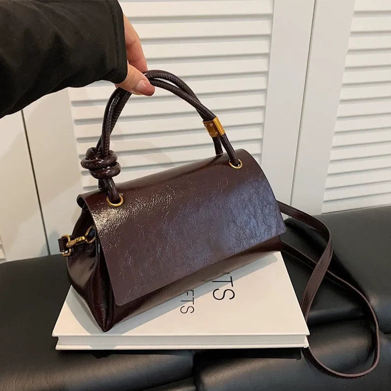 Women’s crossbody bag with mini top handle