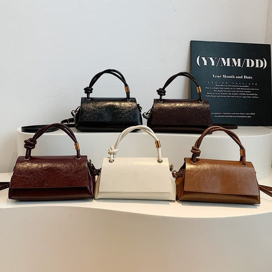 Women’s crossbody bag with mini top handle