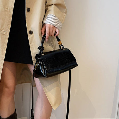 Women’s crossbody bag with mini top handle