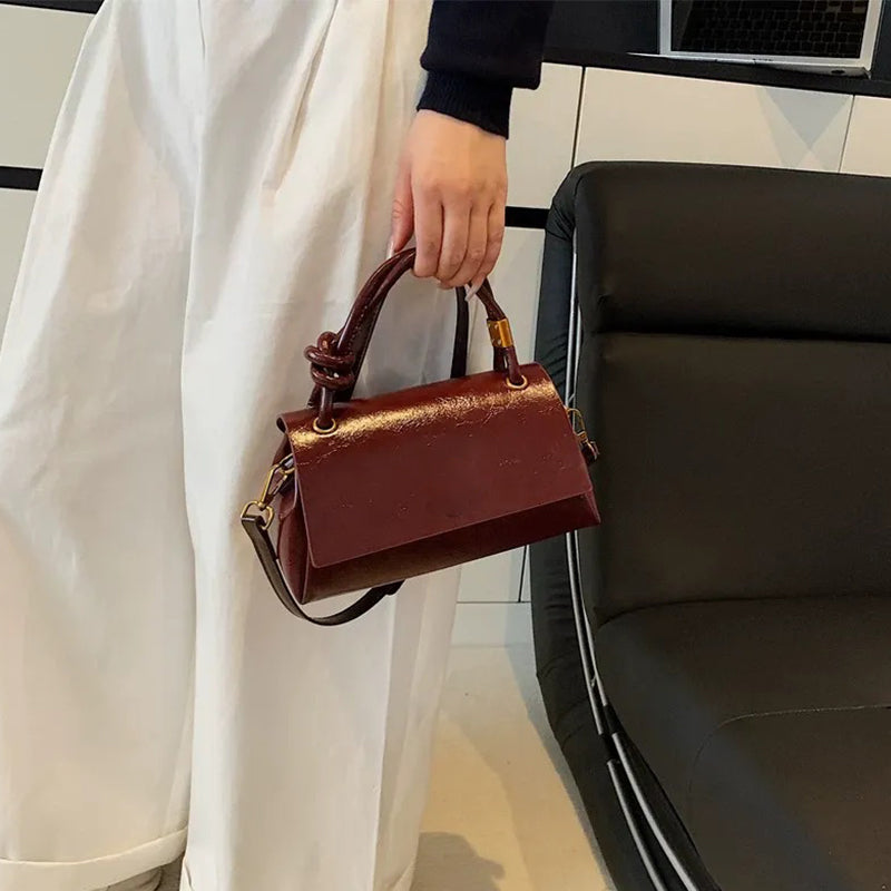 Women’s crossbody bag with mini top handle