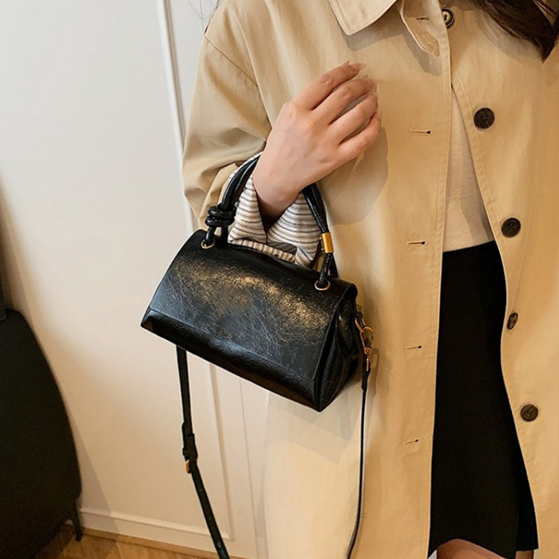 Women’s crossbody bag with mini top handle