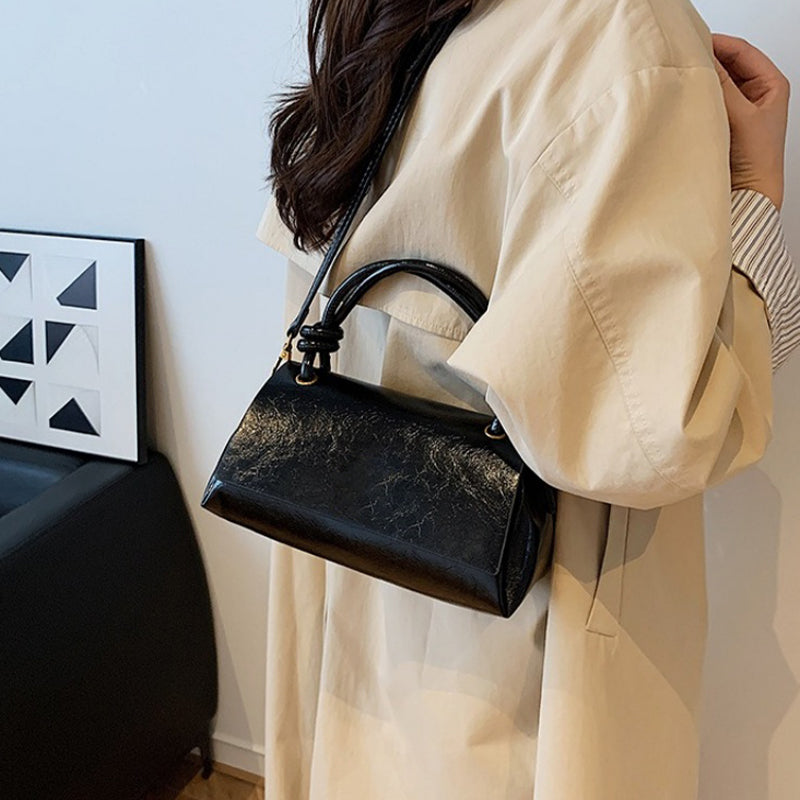 Women’s crossbody bag with mini top handle