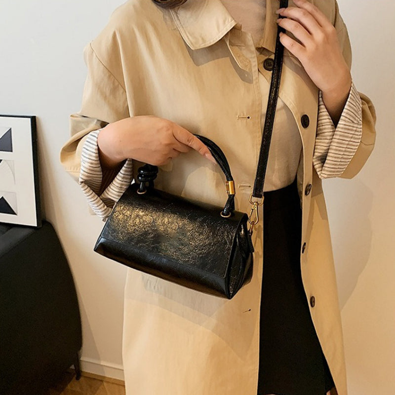 Women’s crossbody bag with mini top handle