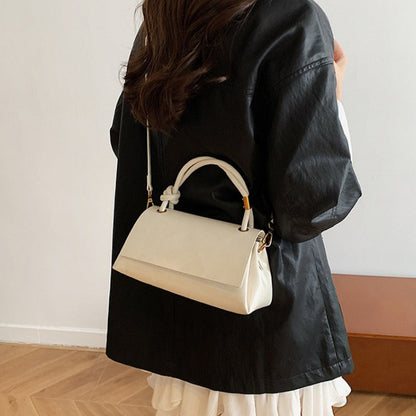 Women’s crossbody bag with mini top handle