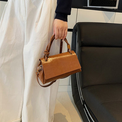 Women’s crossbody bag with mini top handle