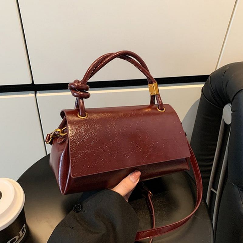 Women’s crossbody bag with mini top handle