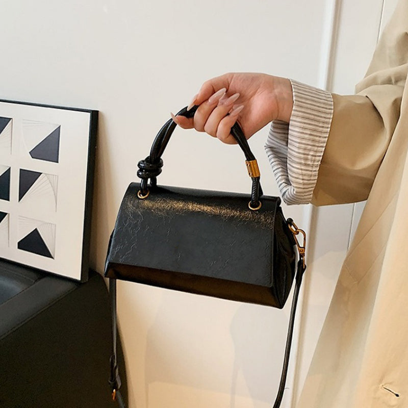 Women’s crossbody bag with mini top handle